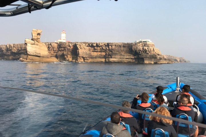 a group of people on a boat in the water